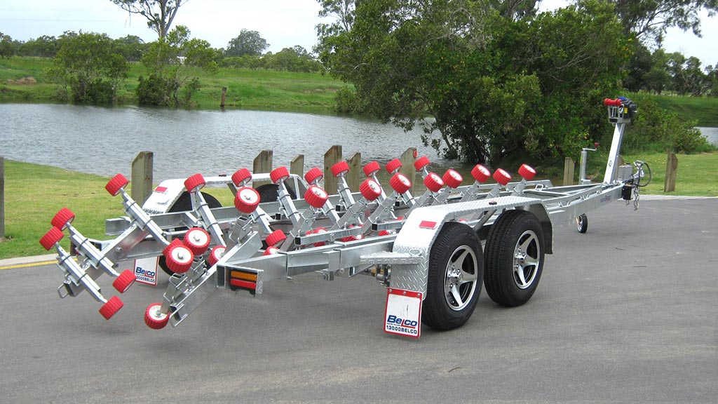 Tandem axle boat trailer parked next to a lake in Brisbane